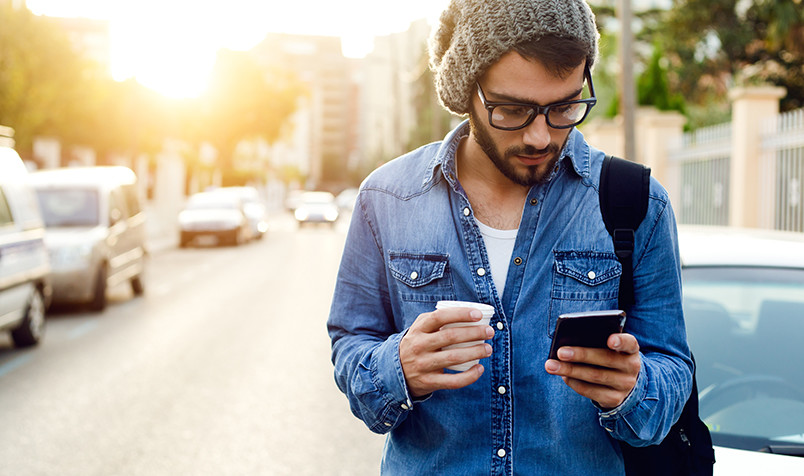 Man Standing, Millennial, Standing In Street, Looking at Phone, Fall Season