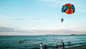 Wind Surfing, Ocean, Sand, People in the Background