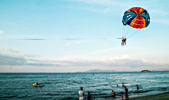 Wind Surfing, Ocean, Sand, People in the Background