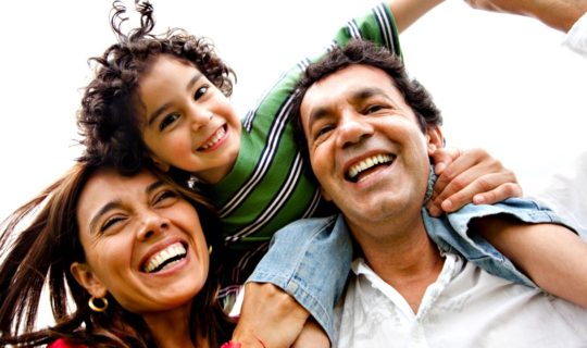 Sandwich GenerationFamily Smiling, Mother, Father, and Son, White Background