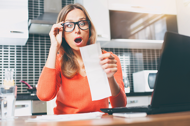 Surprised Woman, Looking at Bill, In Kitchen, At Computer, Sunshine