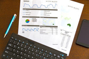 Desk, Financial Report, Pen, Smartphone, Keyboard on Desk