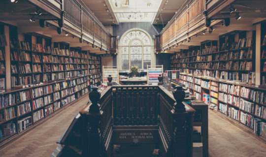 Large Library, Large Quantity Of Books, Stairs Leading To Lower Level