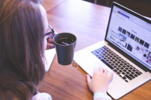 Female Holding Cup of Tea, Computer, Desk, Daylight