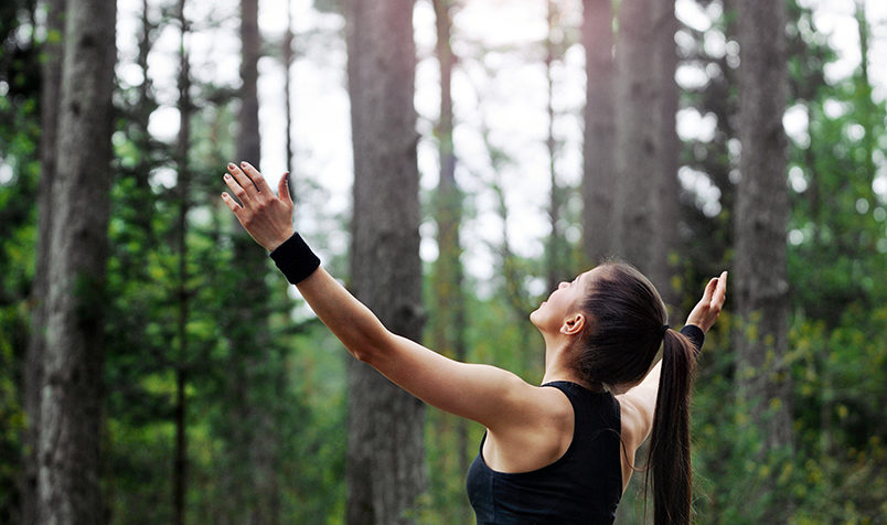 Woman With Open Arms, Exercising Outdoors In Nature