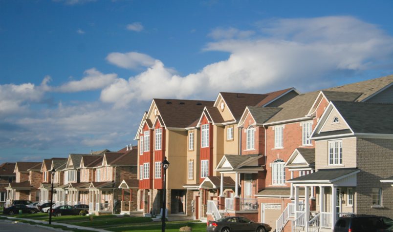 Apartment and houses with a blue sky