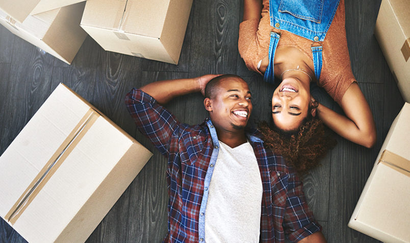 Shot of an attractive young couple moving house