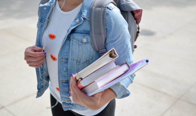 Student holding text books