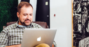 Man sitting down on the computer