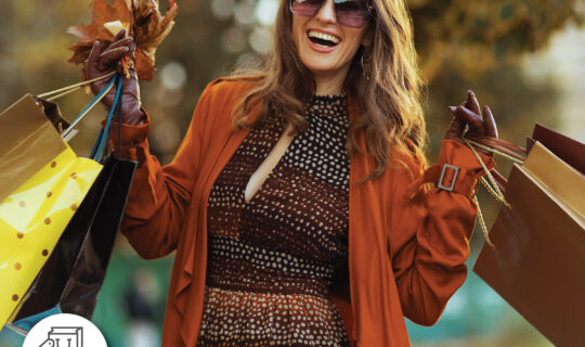 Woman, fall fashion, fall weather, happy, holding shopping bags